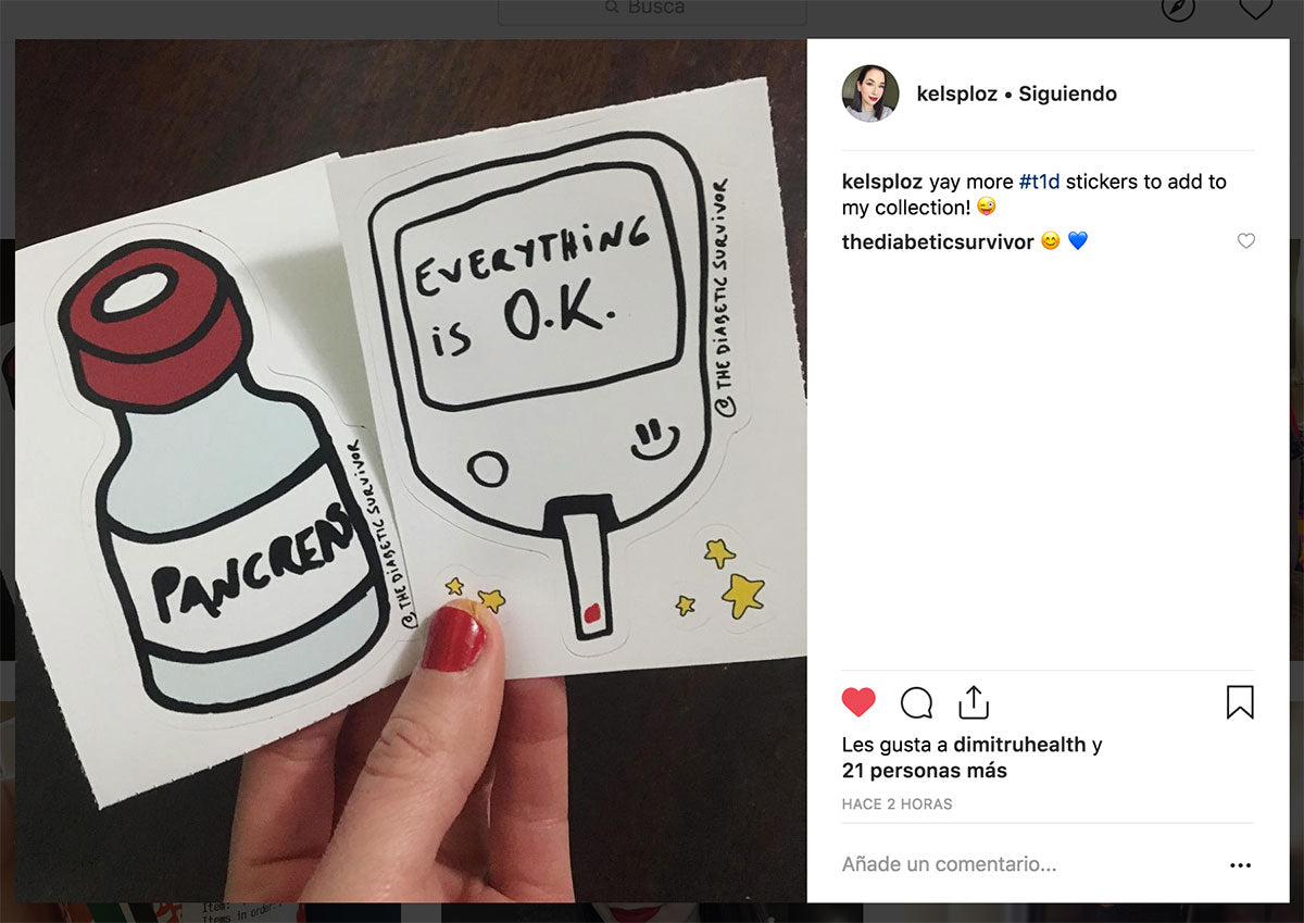 hand of a person living with diabetes holding diabetic stickers