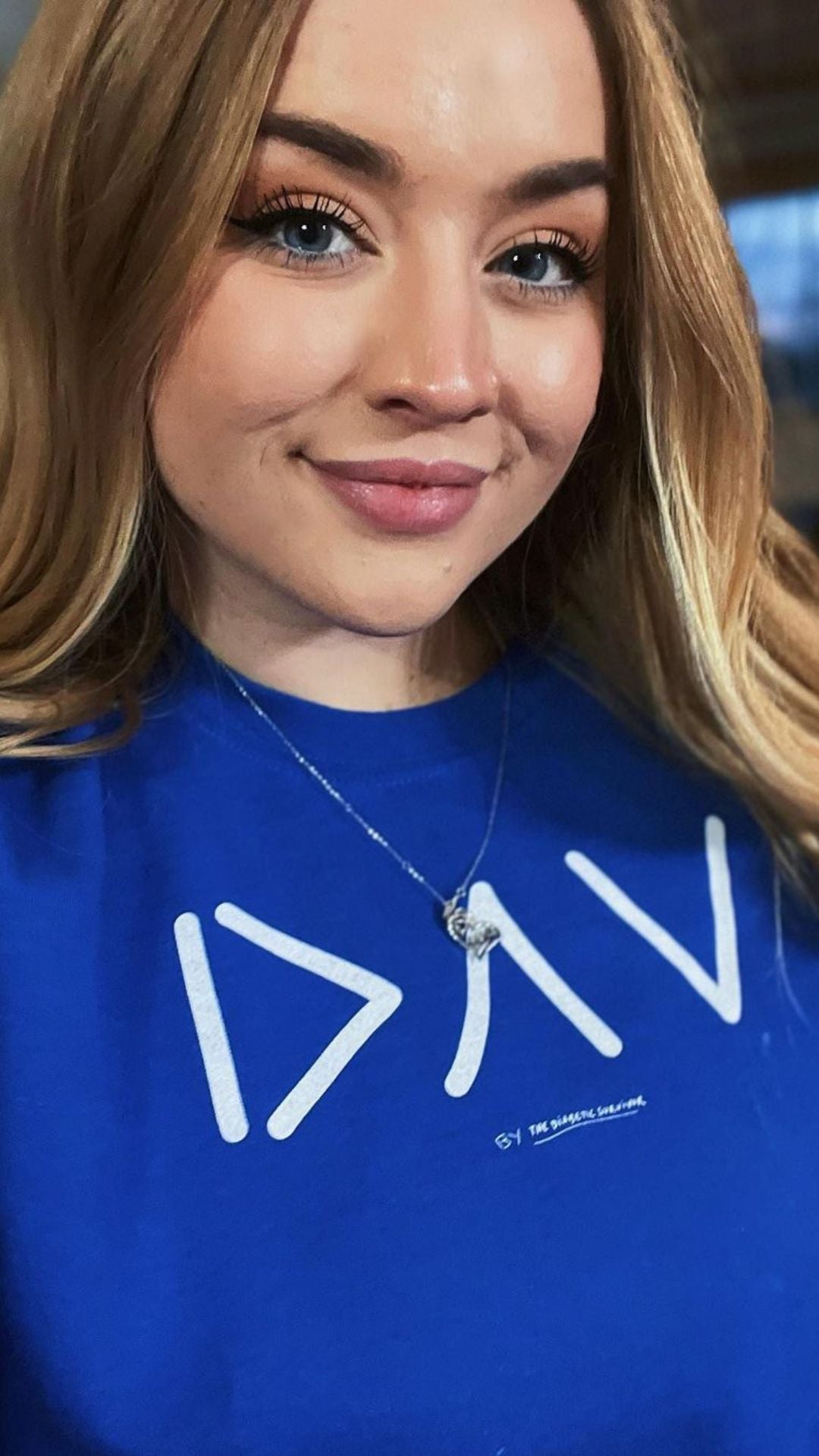 Type 1 Sydnie wearing a blue DAV sweatshirt