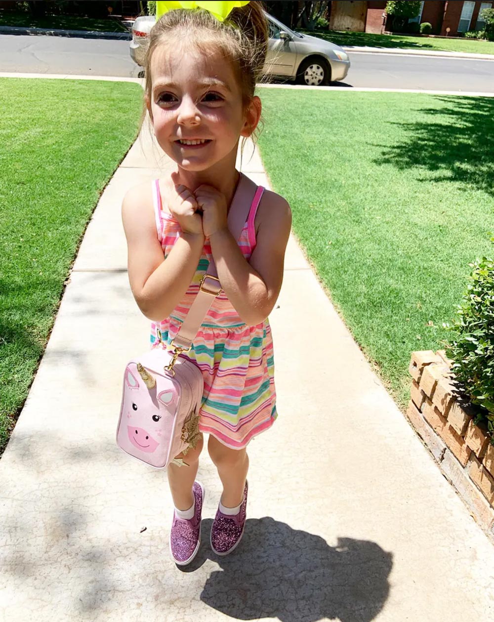 Happy child living with diabetes with unicorn case